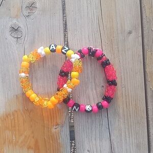 Matching couple demon slayer themed bracelets.